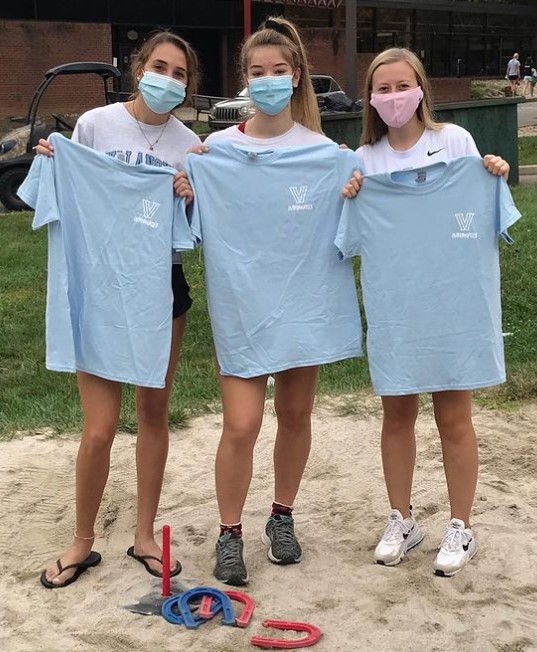 Three female students posing for horseshoes champs photo