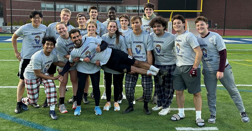 Students posing for ultimate frisbee champions picture
